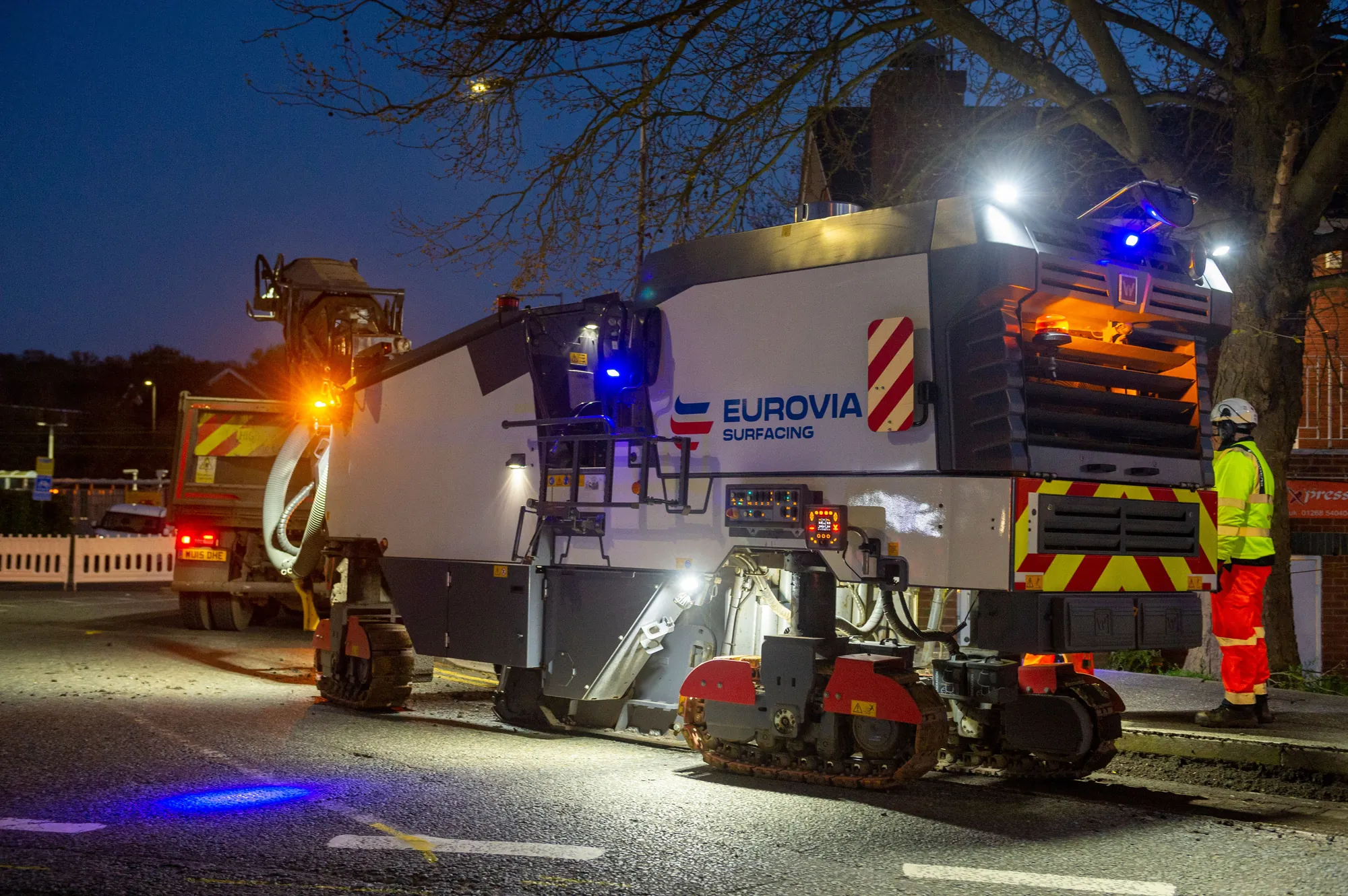 Eurovia Surfacing road-planing machine and operative working under site lights at night